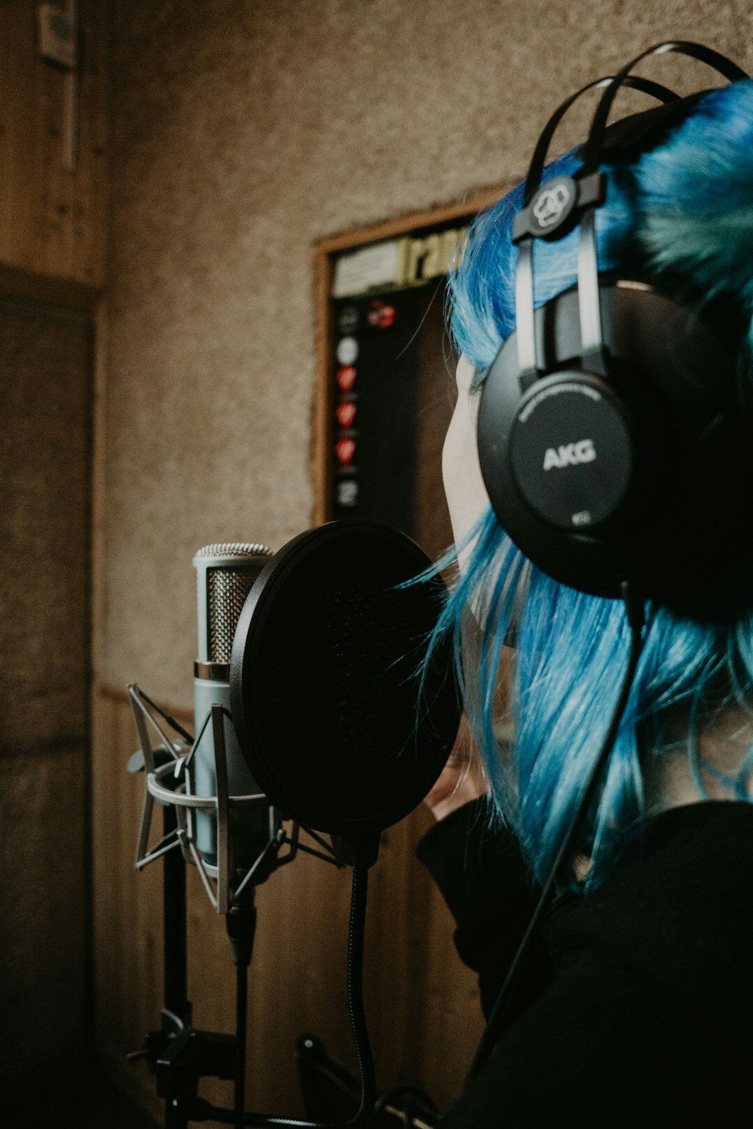 Finnish woman video producer smiling with headset in studio