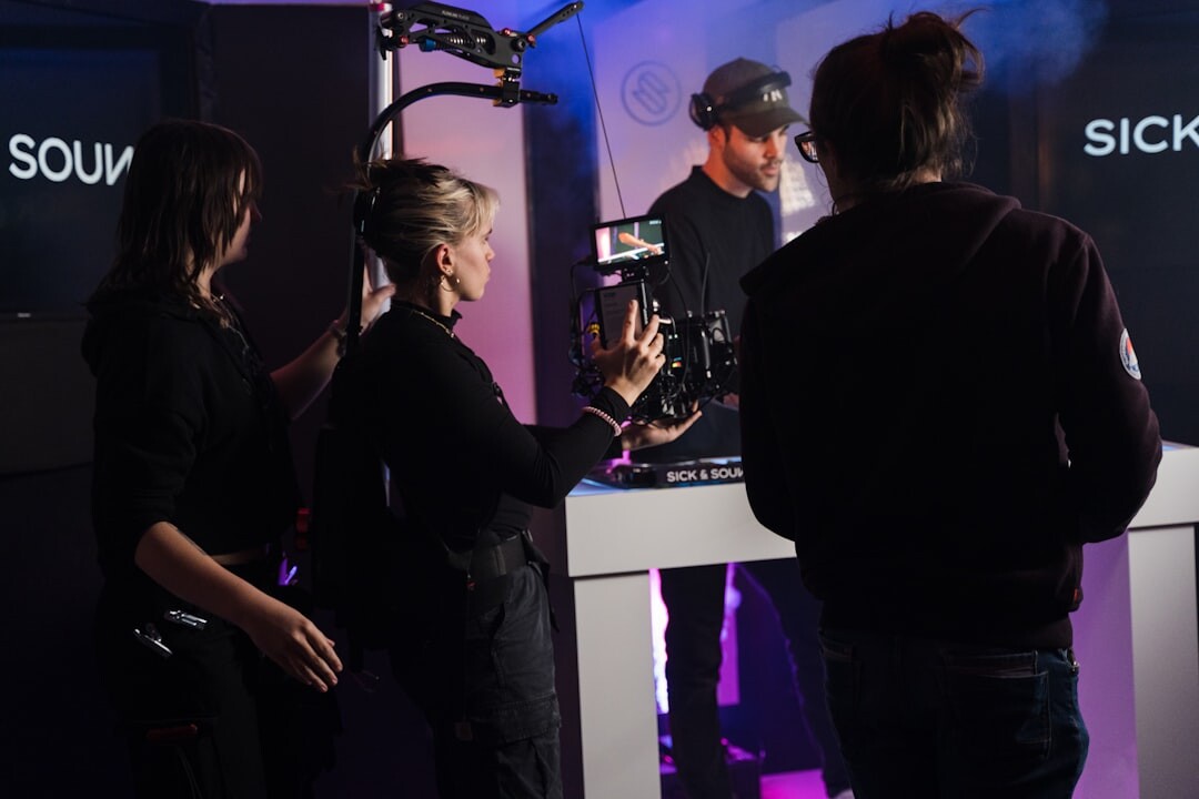 Diverse television production crew standing together in studio