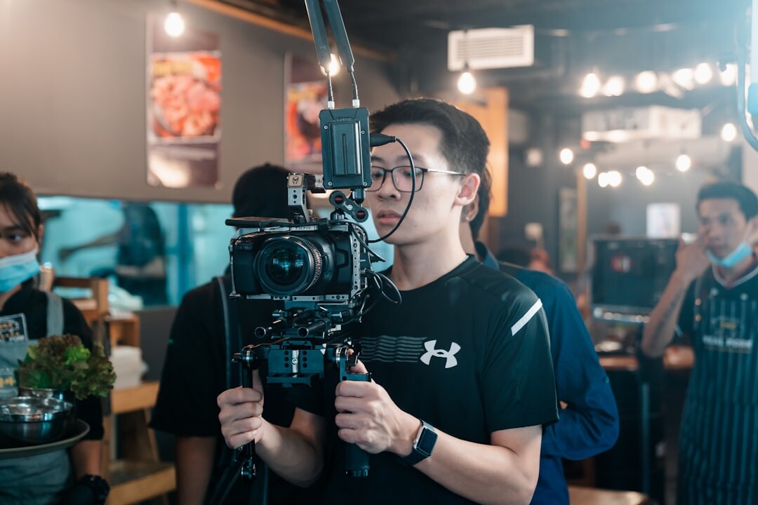 Camera operator filming a live broadcast on set